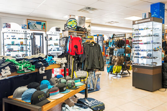 Hats and sportswear on display at a surf shop