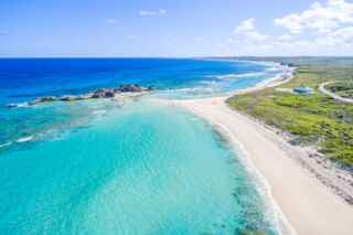 Aerial photo of Dragon Island at Mudjin Harbour on Middle Caicos