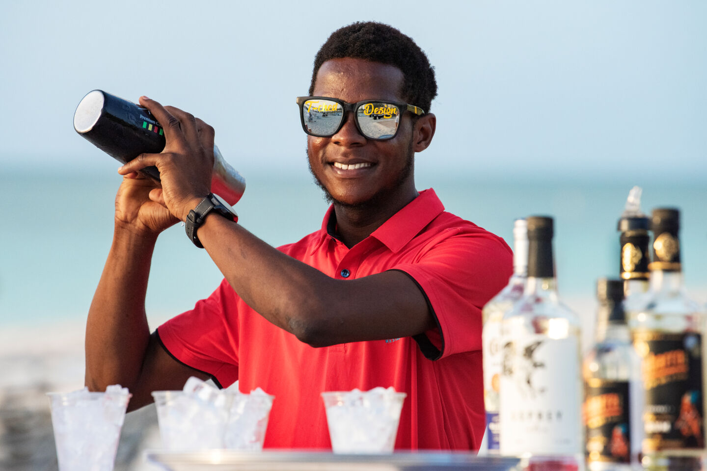 A bartender making a margarita on the beach in Turks and Caicos.