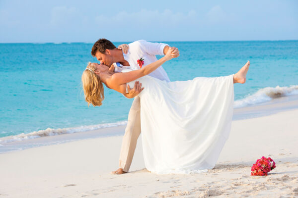 An intimate wedding on Grace Bay Beach, captured by Paradise Photography.