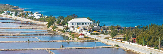 Aerial photo of the Salt Cay Salinas, the Harriott White House, and Victoria Street