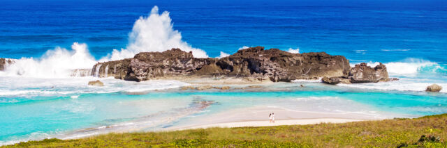 Large waves breaking over Dragon Cay at Mudjin Harbour on Middle Caicos