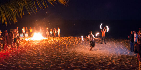Fire dancing and bonfire at Long Bay Beach