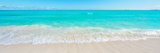 Wave on the beach and turquoise ocean at Cedar Point 