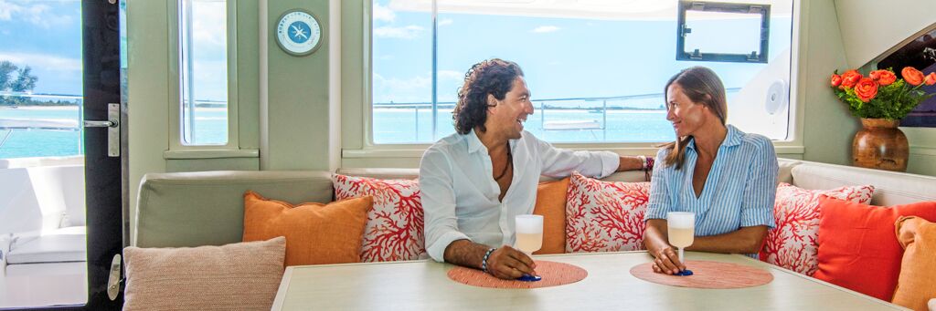 Couple relaxing on a private yacht in the Turks and Caicos. 