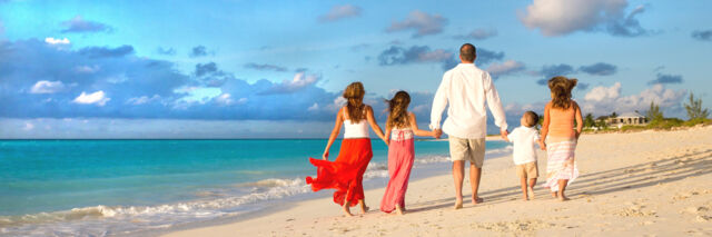 Family photography session on Grace Bay Beach at sunset