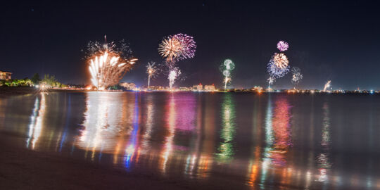 Fireworks at night over Grace Bay Beach and resorts