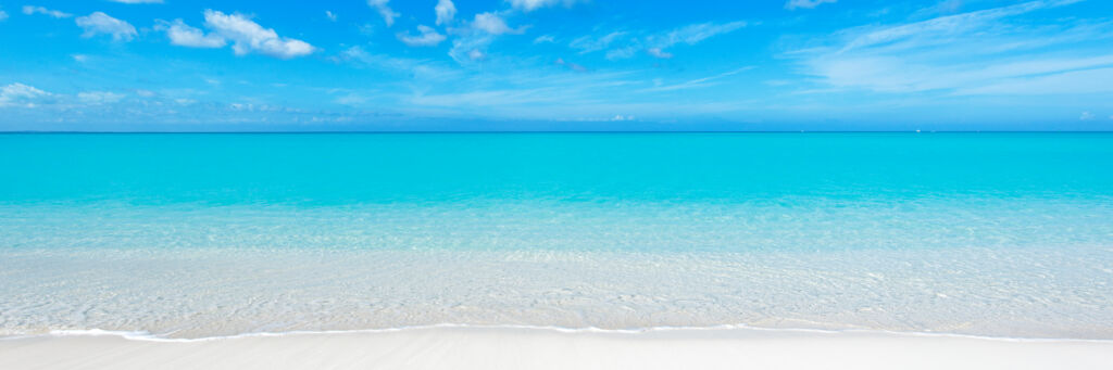 Turquoise ocean and white sand at Grace Bay Beach