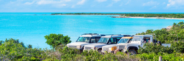 Land Rover Defender and Discovery 4x4s at West Harbour Bluff on Providenciales, Turks and Caicos