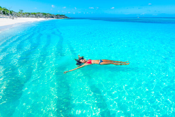 Floating in the clear ocean water at Little Water Cay