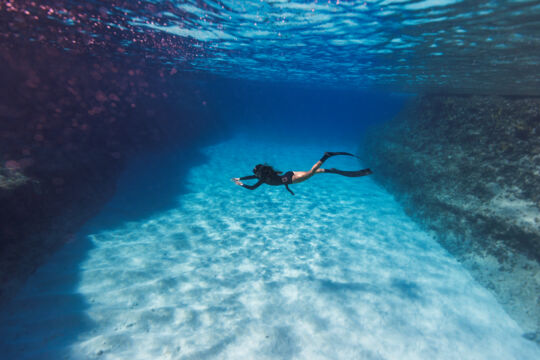 Snorkeling in the clear water of the West Caicos Marine National Park