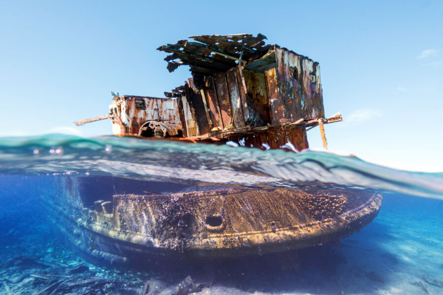 Shipwreck in shallow ocean water