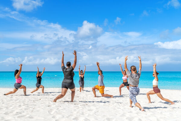 Women's yoga class on Grace Bay Beach.