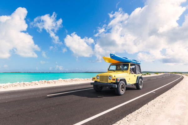 Jeep Wrangler with kayaks driving on the North Caicos and Middle Caicos Causeway