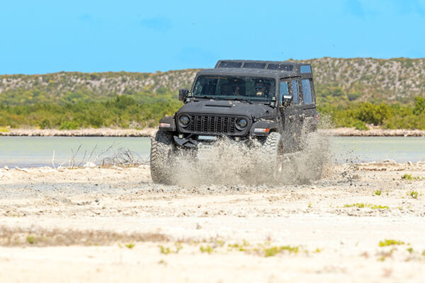 Jeep Wrangler in the mud on an off road track on South Caicos