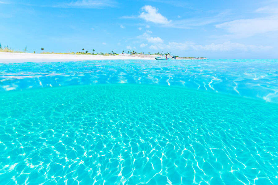 The crystal-clear ocean water at Half Moon Bay Beach in the Turks and Caicos