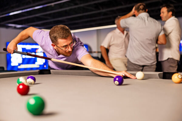 Man playing pool.