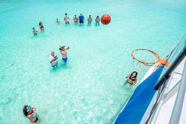 Playing water basketball on a boat charter in the Turks and Caicos