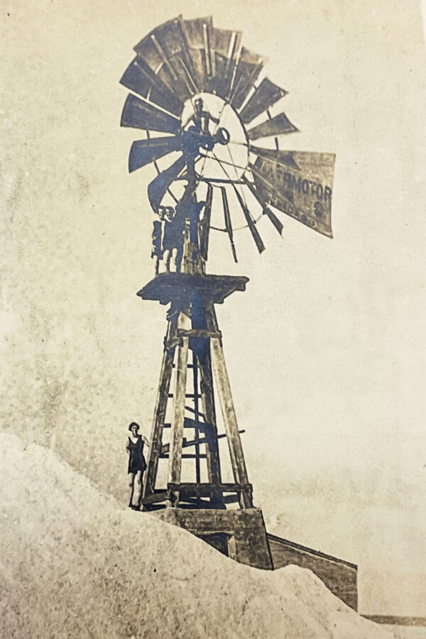 old photo of a large windmill and salt mound on Grand Turk in the Turks and Caicos