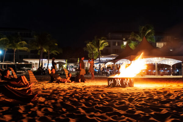 Cozy bonfire on the beach at night in Turks and Caicos. 