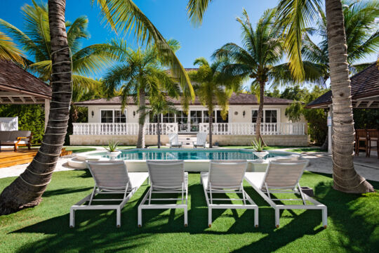 Loungers in the courtyard at Acajou Villa