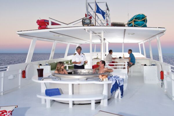 Couple in a hot tub on a yacht in Turks and Caicos.