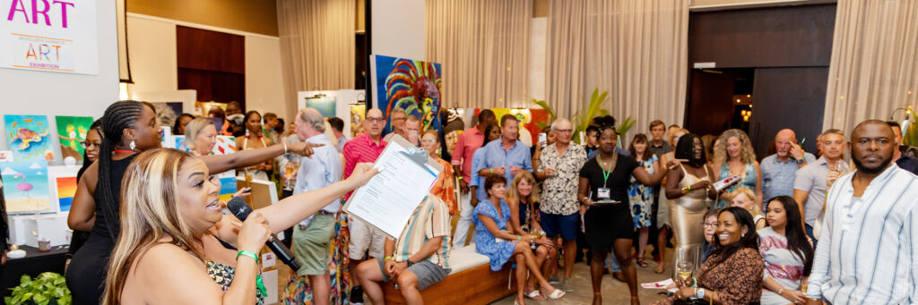 People bidding on art at a luxury resort in Turks and Caicos.