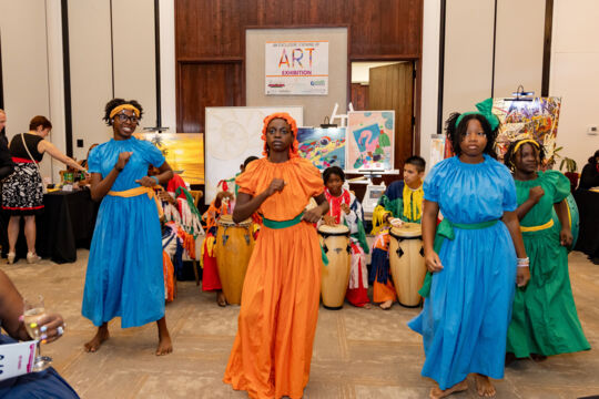 Dancers performing at an art auction in Turks and Caicos. 