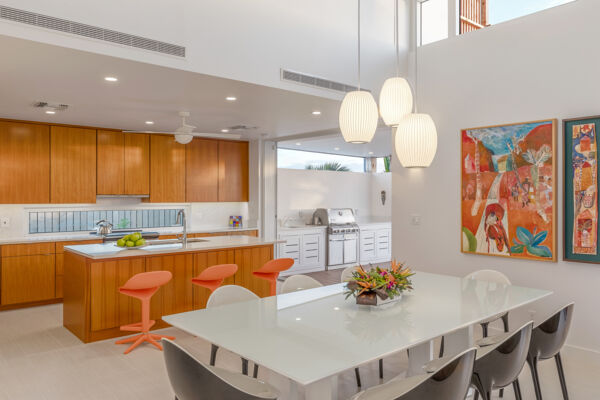 Indoor kitchen and dining area at Aqueous Villa, a modern luxury villa on Providenciales. 