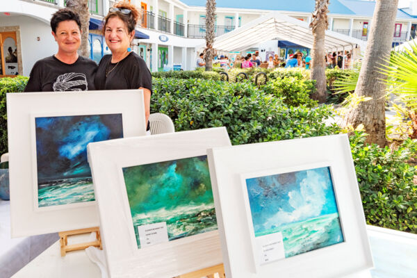 Vendors selling paintings at a Christmas market in Turks and Caicos.