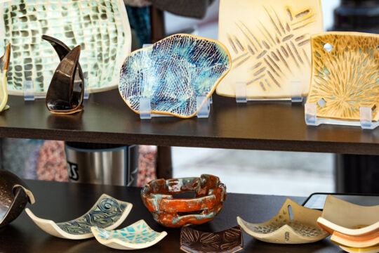 Painted trinket trays and pottery for sale at a Christmas market in Turks and Caicos.