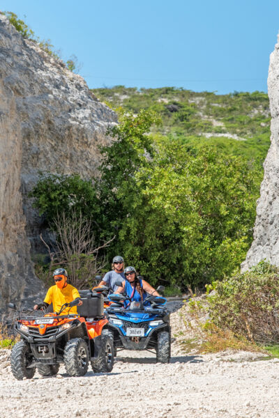 ATVs near a cut in the limestone