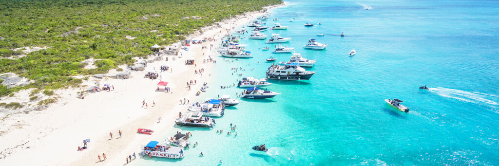 A dozen boats on Water Cay for the Caribbean House Evolution music festival.