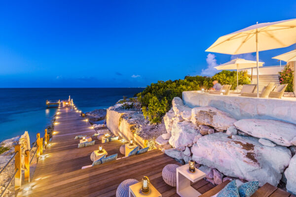 Wooden jetty at dusk at Cave Bar, Providenciales.