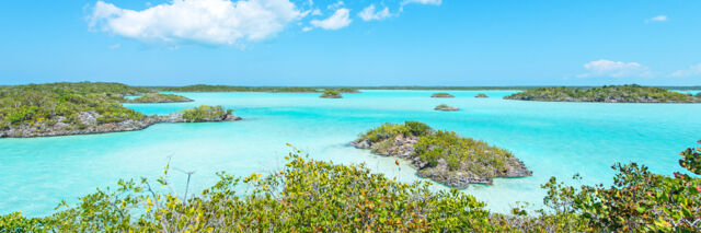 Turquoise water and small islands in Chalk Sound 