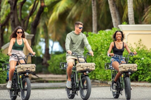 Cyclists exploring a shopping plaza in Grace Bay, Providenciales.