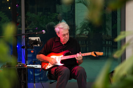 Guitarist performing on a patio in Turks and Caicos. 