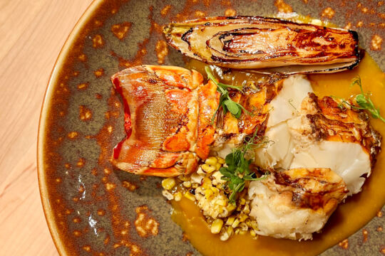 Plated lobster tail dish at a fancy restaurant in Turks and Caicos.