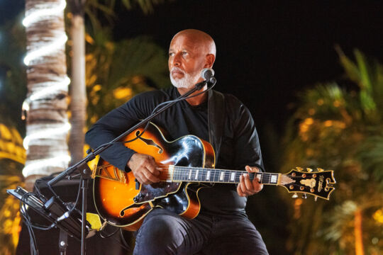 Musician performing in Turks and Caicos at night.