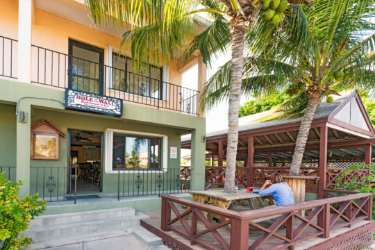 Wooden restaurant patio with coconut tree