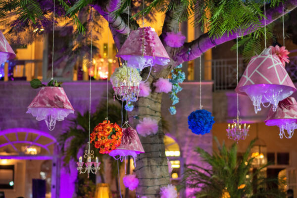 Pink lampshades hanging from a tree at a luxury resort, Providenciales/