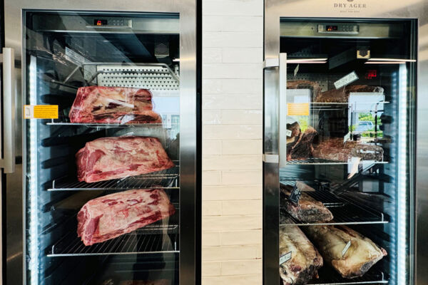 Fridge with large slabs of meat at a butcher shop in Providenciales. 