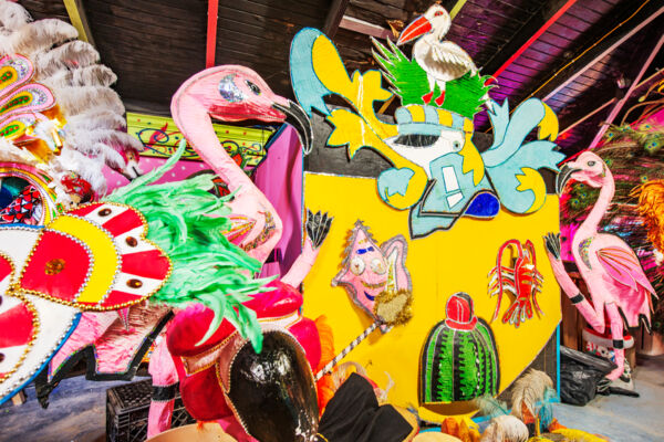 A large colorful prop featuring the Turks and Caicos coat of arms inside the Junkanoo Museum.