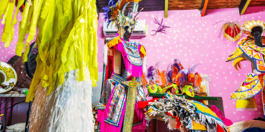 Colorful handmade costumes inside the Turks and Caicos Junkanoo Museum.