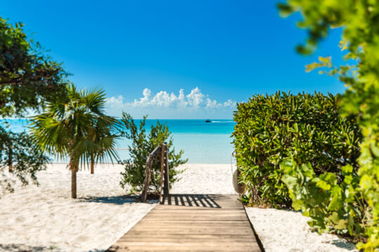 Wood boardwalk between Lilikoi villa and the beach