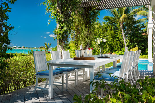 Outdoor dining table and chairs at Lilikoi villa