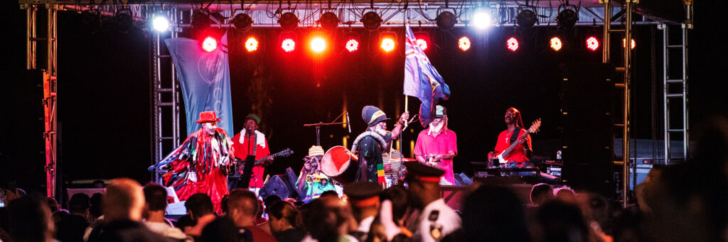 A band playing on a lit stage at the Maskanoo festival in Turks and Caicos.