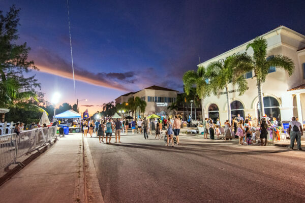 A small crowd gathers for the Maskanoo festival on Providenciales at dusk.