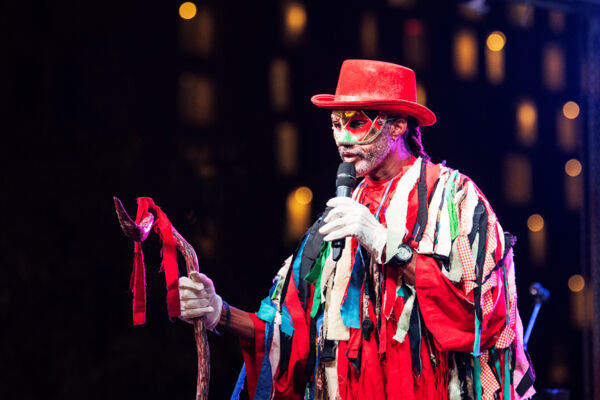 Former Director of Culture David Bowen wearing an elaborate costume on stage at Maskanoo.