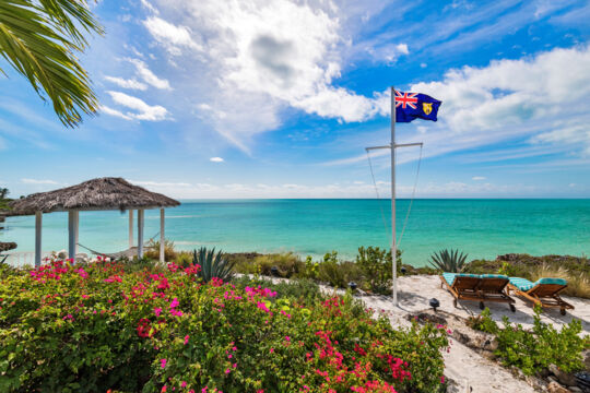 Cabana and flagpole with Turks and Caicos flag